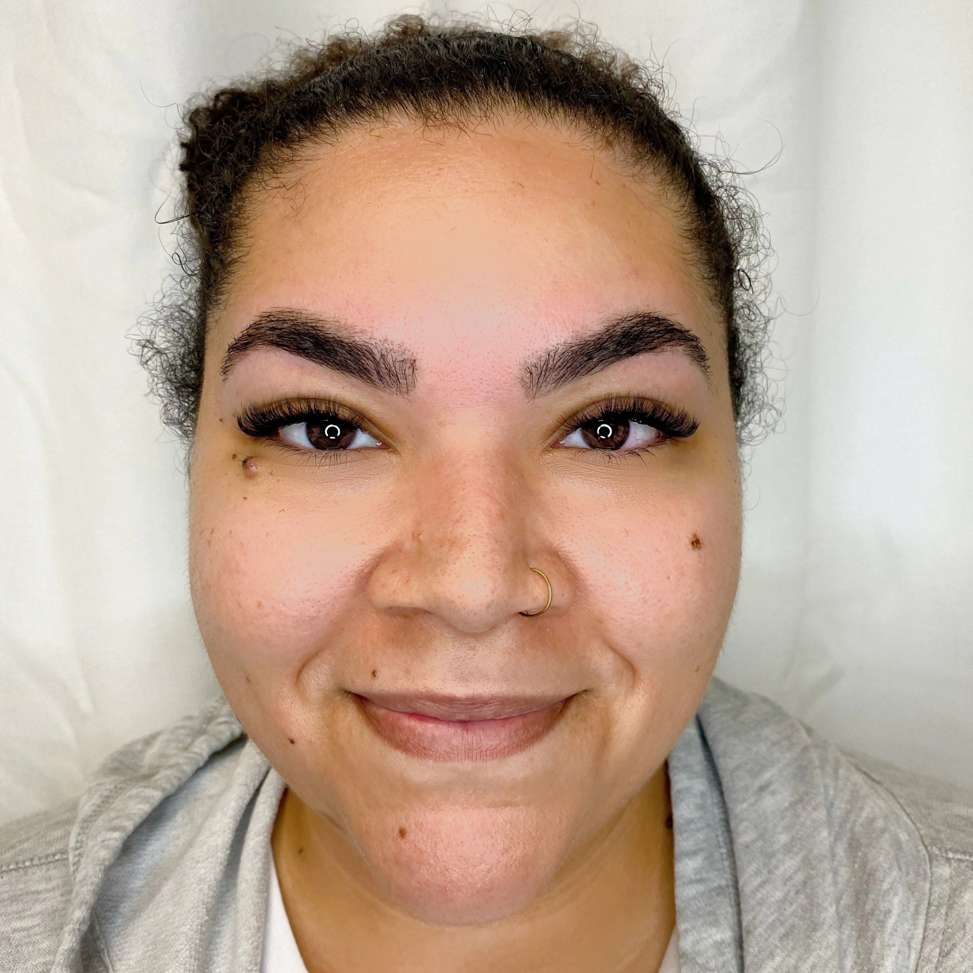 Client with freshly shaped, defined brows